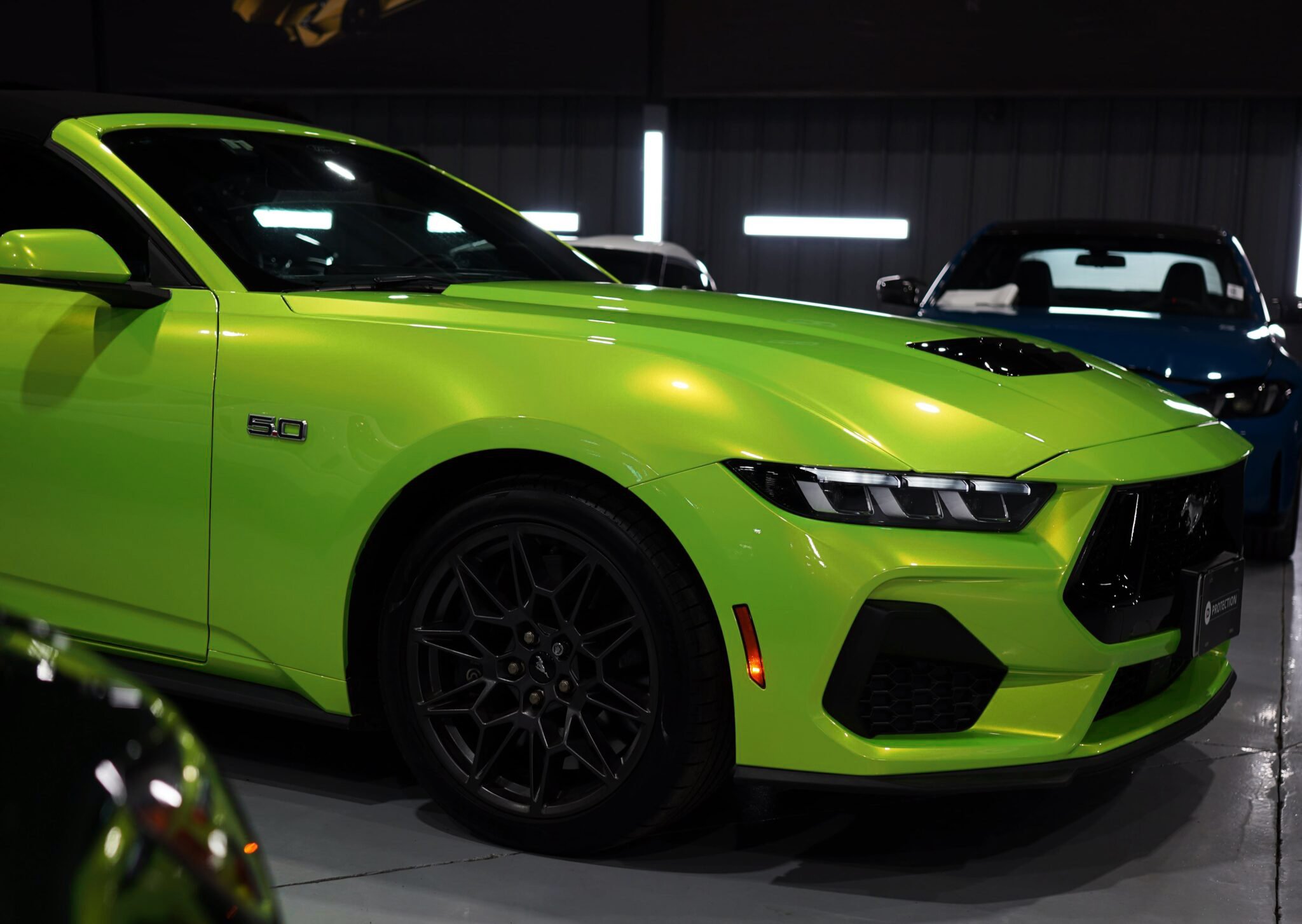 Lime green color PPF wrap on a Ford Mustang